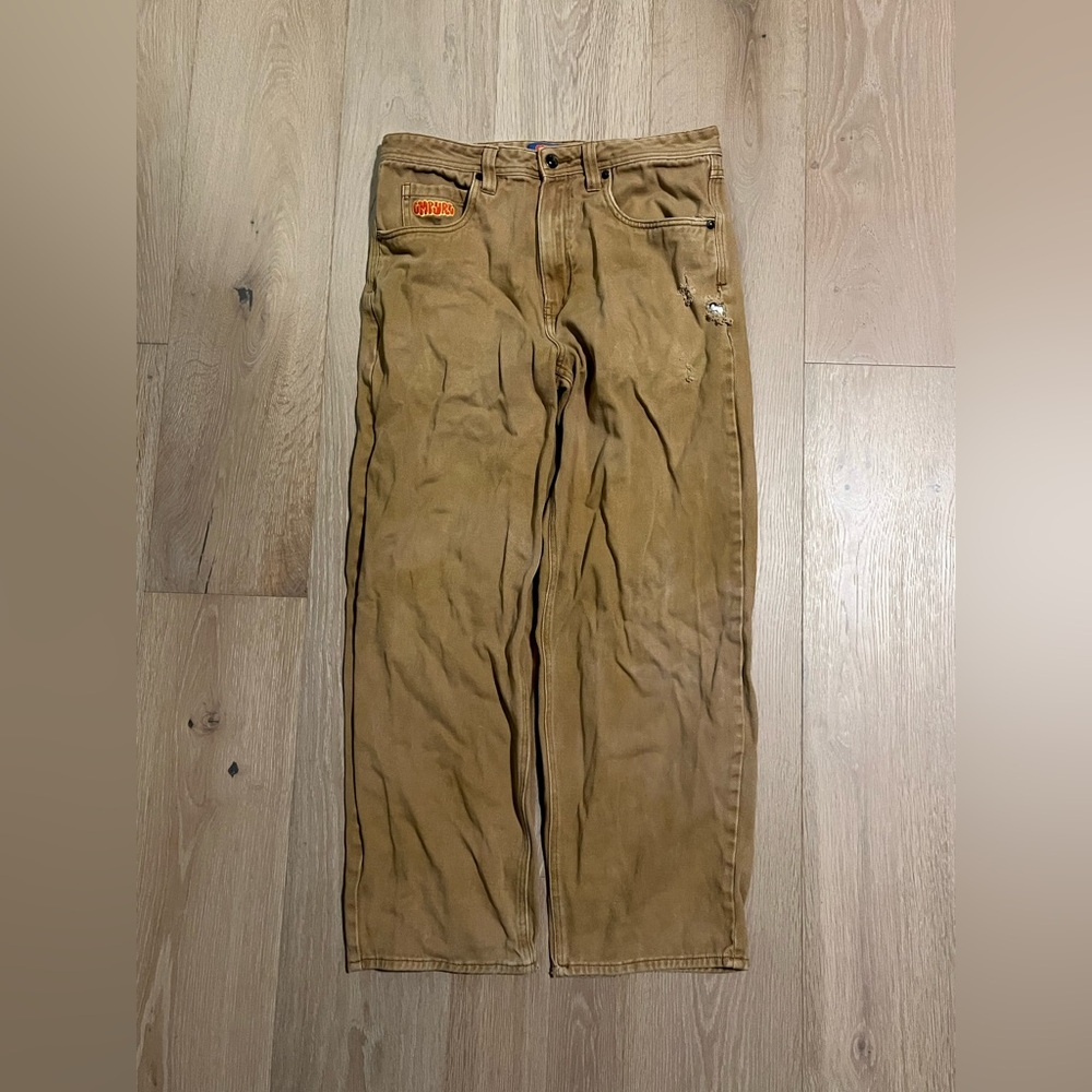 Tan empyre relaxed/baggy workwear jeans with thrashed hole near pocket